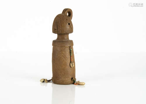 A Chamba ceramic doll / figure, with beadwork and cowrie shell strands, height 22cm