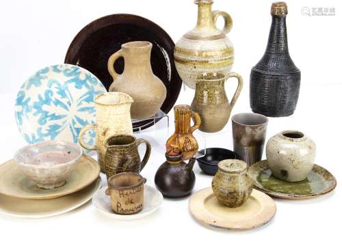 A collection of contemporary stoneware ceramics, including plates, jugs, serving dishes, decorated