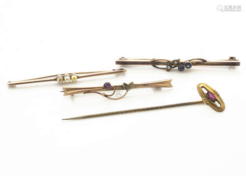 A collection of gold bar brooches, including a sapphire and seed pearl example and three gem set