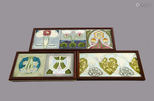 A set of three framed continental Art Nouveau tiles, relief moulded floral decoration glazed in