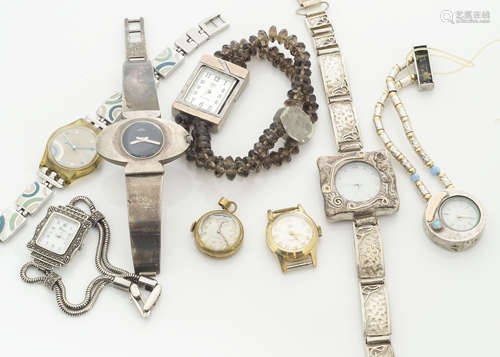 A collection of various ladies wristwatches, including a silver elliptical cased and strap