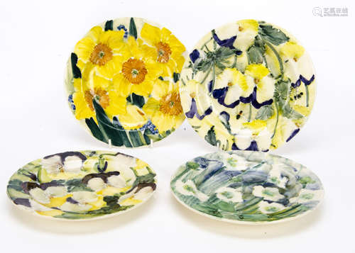 A set of four contemporary stoneware Jonathan Cox floral decorated plates, two of pansies, another