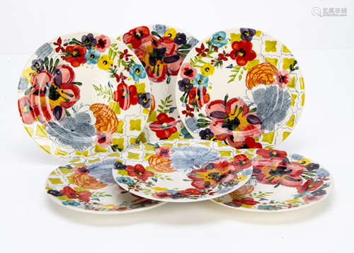 A set of six continental contemporary pottery plates, with underglazed floral decoration painted