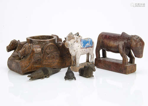 A group of Indian carvings to include Oxen, various multi-compartmental boxes and several brass cast