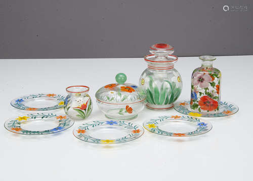 A collection of Art Deco painted floral glass items, including a jar and cover with white and yellow