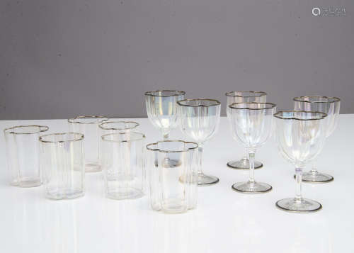 A part suite of early 20th Century iridescent glassware, the quatrefoil shaped glasses comprising
