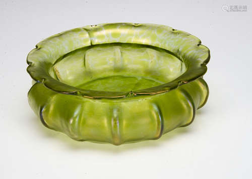 A Bohemian iridescent green glass shallow centrepiece, of lobed circular form with inverted neck and