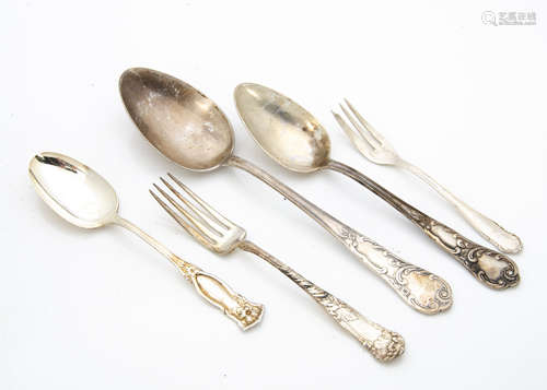 A collection of various continental silver plated Art Nouveau flatware, including spoons, forks,