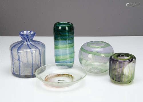 A collection of contemporary glassware, including a cylindrical blue shoulders vase with sloping