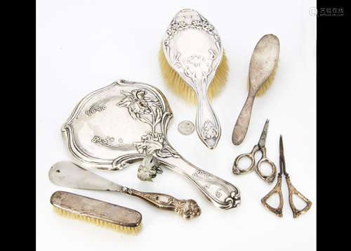 A collection of various silver backed dressing table items, comprising an Edward VII hand mirror,