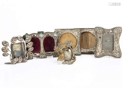 A collection of silver and silver plated photograph frames, comprising a pair of Edward VII wooden