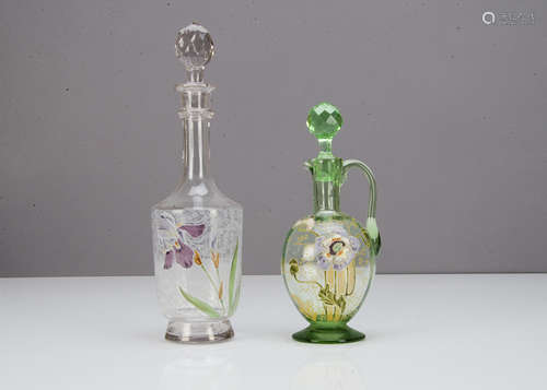 Two Mont Joye decanters and stoppers, one with mauve iris decoration against an acid etched floral