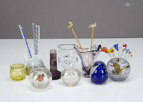 A miscellaneous collection of small posy vases, including an amethyst bulbous example with applied