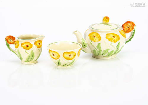 A Grindley Pottery Art Deco three piece teaset, the bachelor tea set with moulded yellow flower