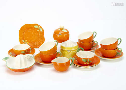 A Crown Devon orange moulded and pattern part tea set, comprising six cups, six saucers, one side