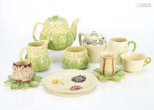 A three piece Staffordshire Art Deco teaset, with moulded primrose decoration, also in the lot two