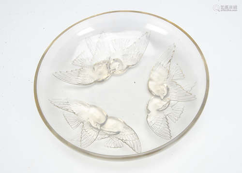 A Rene Lalique opalescent glass footed dish Nonnettes pattern, the circular shallow dish decorated