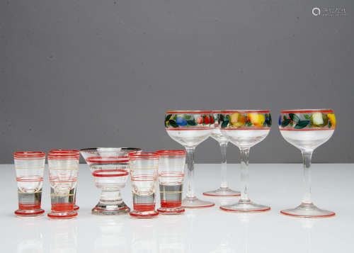 A set of four painted glass liquor glasses, decorated with fruit with red banding, 12cm, a banded