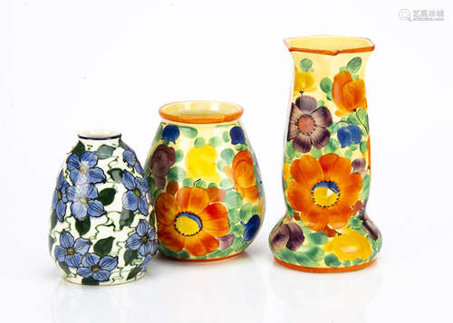 Three Art Deco Czechoslovakian pottery vases, two with similar decoration painted with colourful