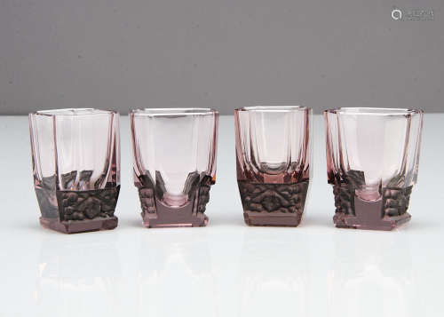 A set of four Art Deco amethyst heavy liquor glasses, of rectangular form with canted corners and