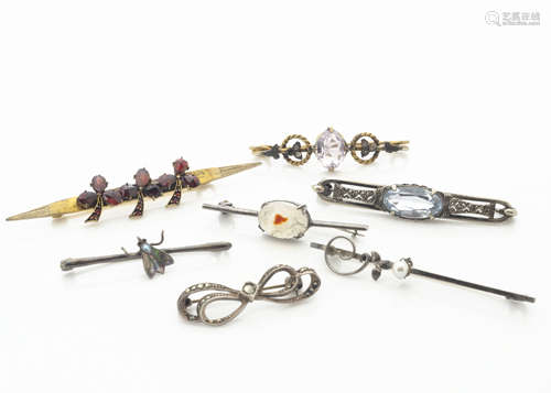 Seven early 20th Century bar brooches, including garnet set gilt metal clover brooch, amethyst and