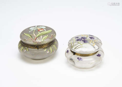 Two continental glass Art Nouveau dressing table jars and covers, one with enamel decoration in