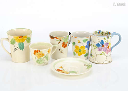 Four Art Deco hand painted pottery mugs, one by Hancocks for the ivory ware range, another by Adams,