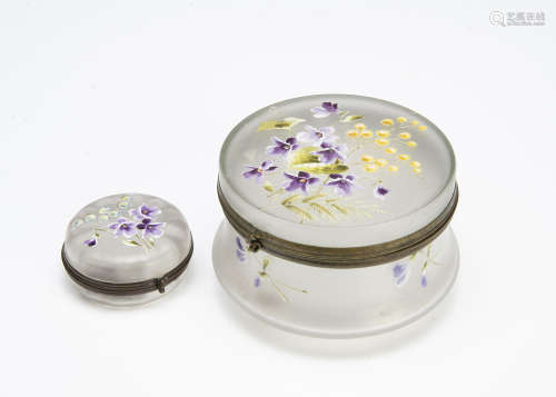 Two continental Art Nouveau glass dressing table jars and covers, both of cylindrical shape, one