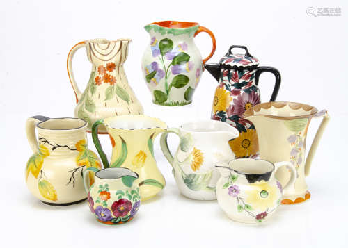 A collection of Art Deco and later jugs, some by Myott & Sons, Wade Heath, all decorated with