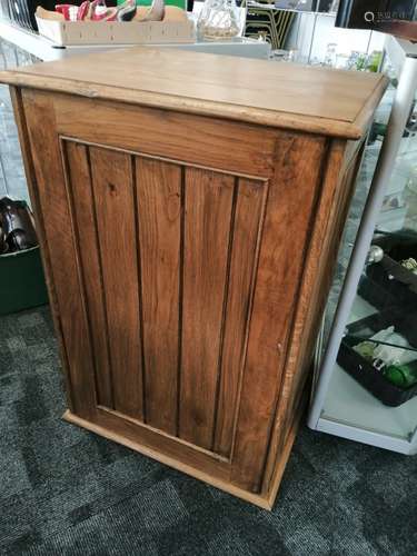 A contemporary oak three quarter height square bookcase, with panelled sides, moulded top fitted