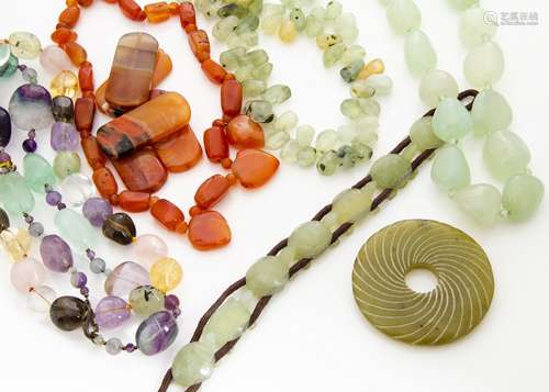 A large collection of rock crystal, amethyst, citrine and hardstone necklaces, pendants and beads,