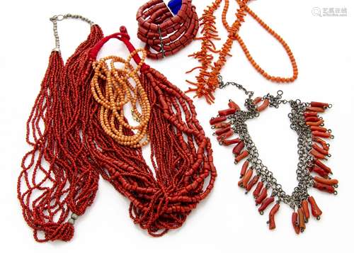 A collection of coral jewellery, including a Middle Eastern white metal and coral fringe necklace, a