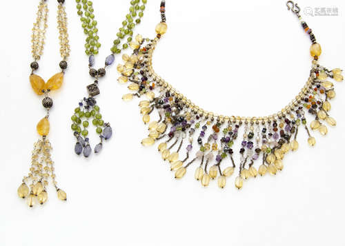 A continental multi gem set fringe necklace, with citrines, amethysts, garnets and white metal