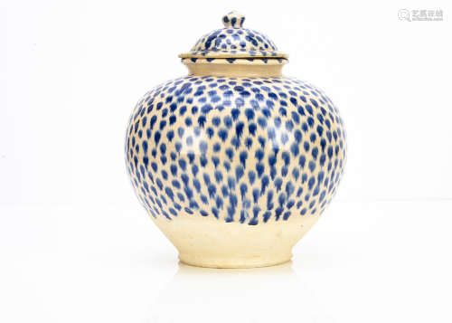 A large continental stoneware jar and cover, of bulbous form with domed lid decorated with a blue