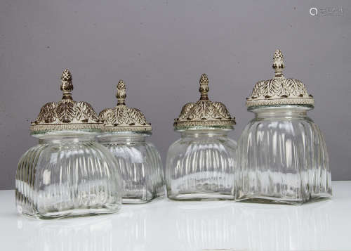 A set of three contemporary glass and resin storage jars, in the Middle Eastern style, the moulded