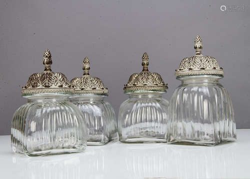 A set of three contemporary glass and resin storage jars, in the Middle Eastern style, the moulded