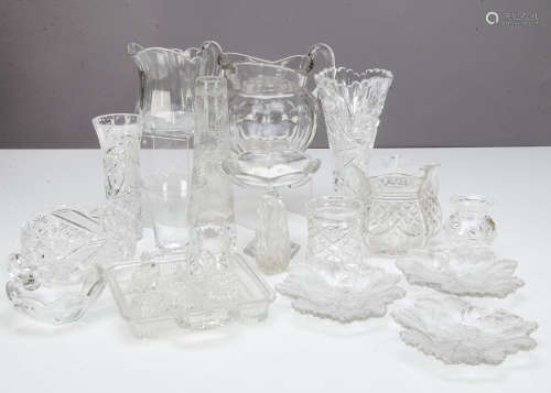 A collection of cut glassware, including a continental tapered cut glass flower a vase on a circular