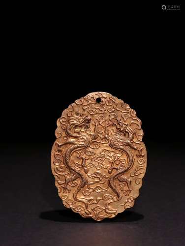 A CHINESE GILD COPPER MINISTERS PUNISHMENTS PENDANT