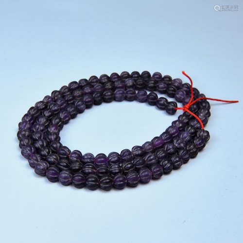 AN AMETHYST BUDDHA PEARL STRING WITH 108 BEADS SHAPED WITH MELON RIBS IN LIAO DYNASTY