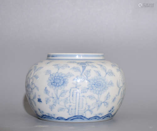 A BLUE AND WHITE POT PAINTED WITH FLOWERS