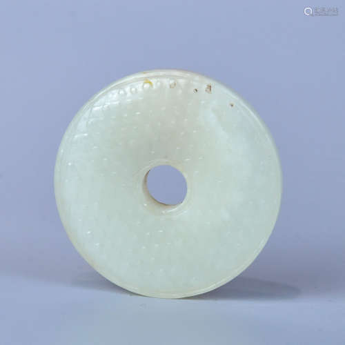 A HETIAN WHITE JADE  MADE OF SEED MATERIAL AND CARVED WITH  ANTIQUE PATTERNS