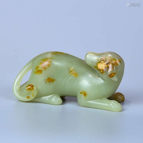 A HETIAN WHITE JADE DOG MADE OF SEED MATERIAL