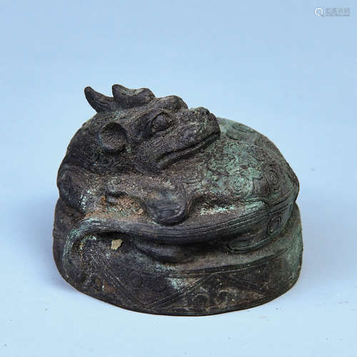 A COPPER MATWEIGHT SHAPED WITH DRAGON HEAD