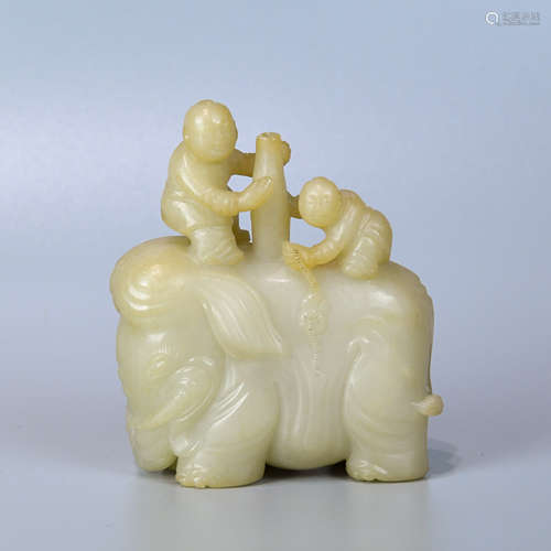 A WHITE JADE ORNAMENT OF BOY RIDING AN ELEPHANT