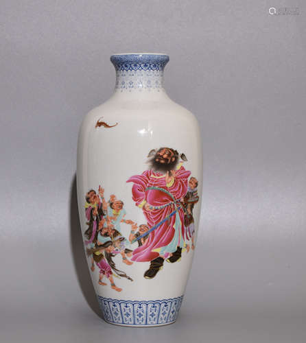 AN ENAMEL BOTTLE PAINTED WITH CHARACTERS