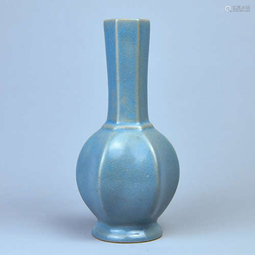 A SKY BLUE GLAZE AQUARE BOTTLE WITH SIX ARRIESES