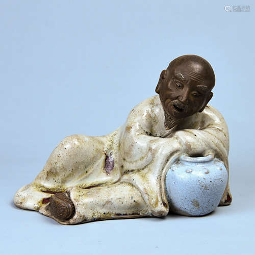 A SHIWAN KILN STATUE