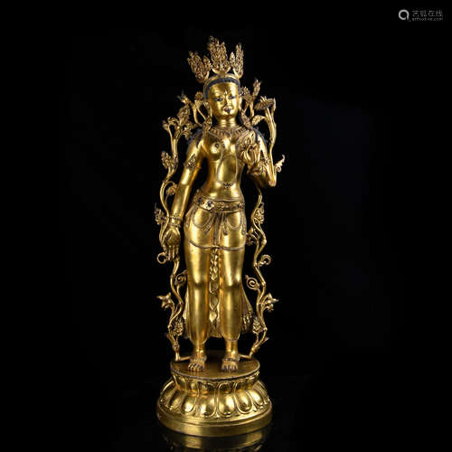 A COPPER-GILDED STANDING STATUE OF GUANYIN