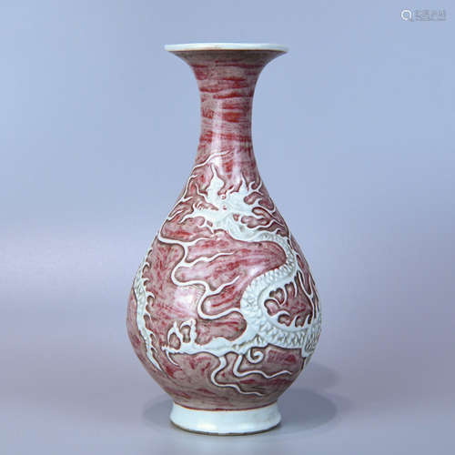 AN UNDERGLAZE RED OKHO SPRING BOTTLE CARVED DRAGON PATTERNS