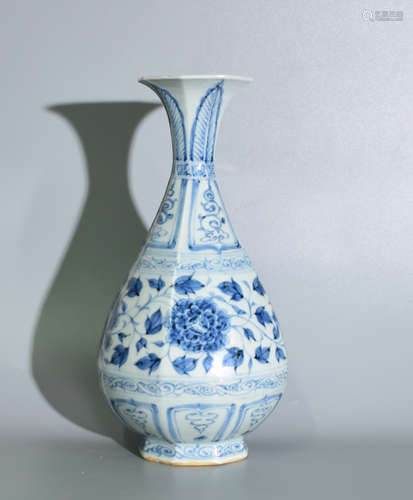 A BLUE AND WHITE OKHO SPRING BOTTLE PAINTED WITH FLOWERS